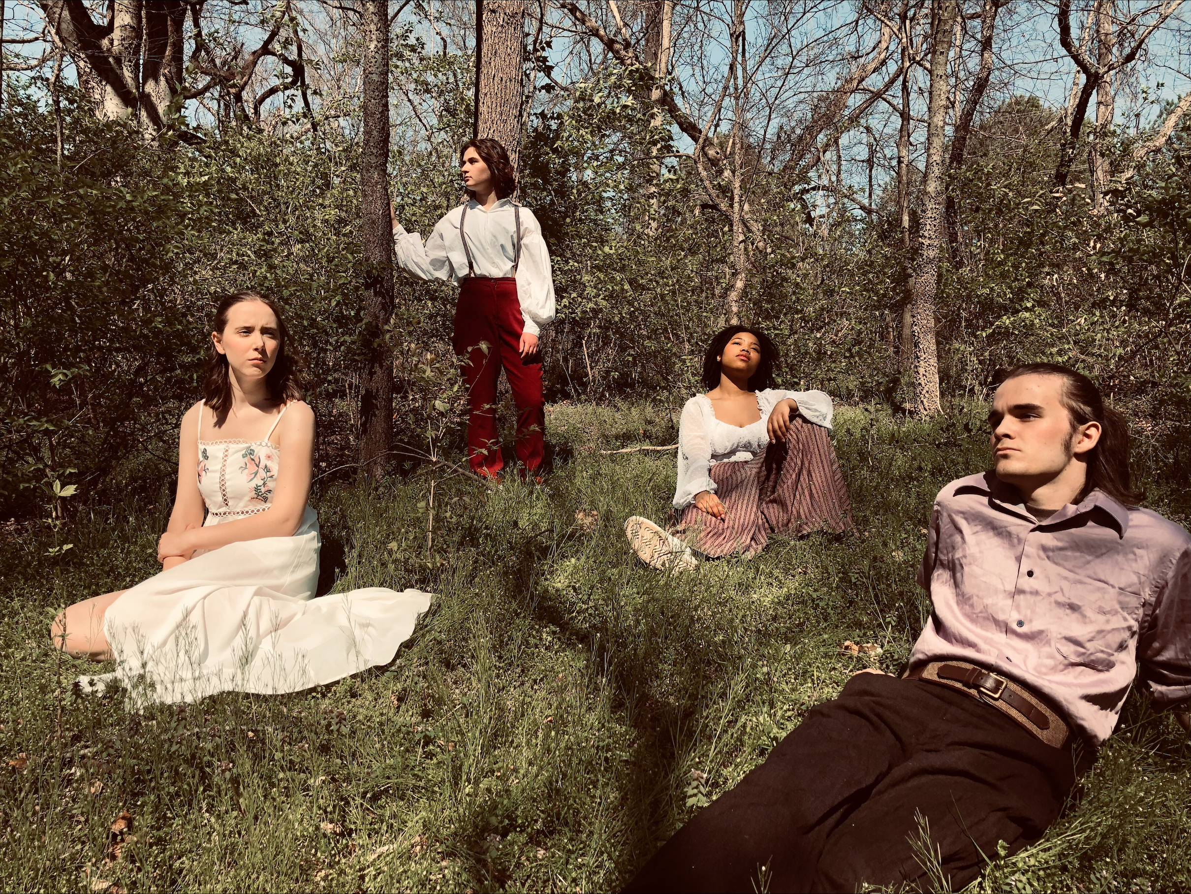 Cast from Midsummer Night Dream pose on the grass