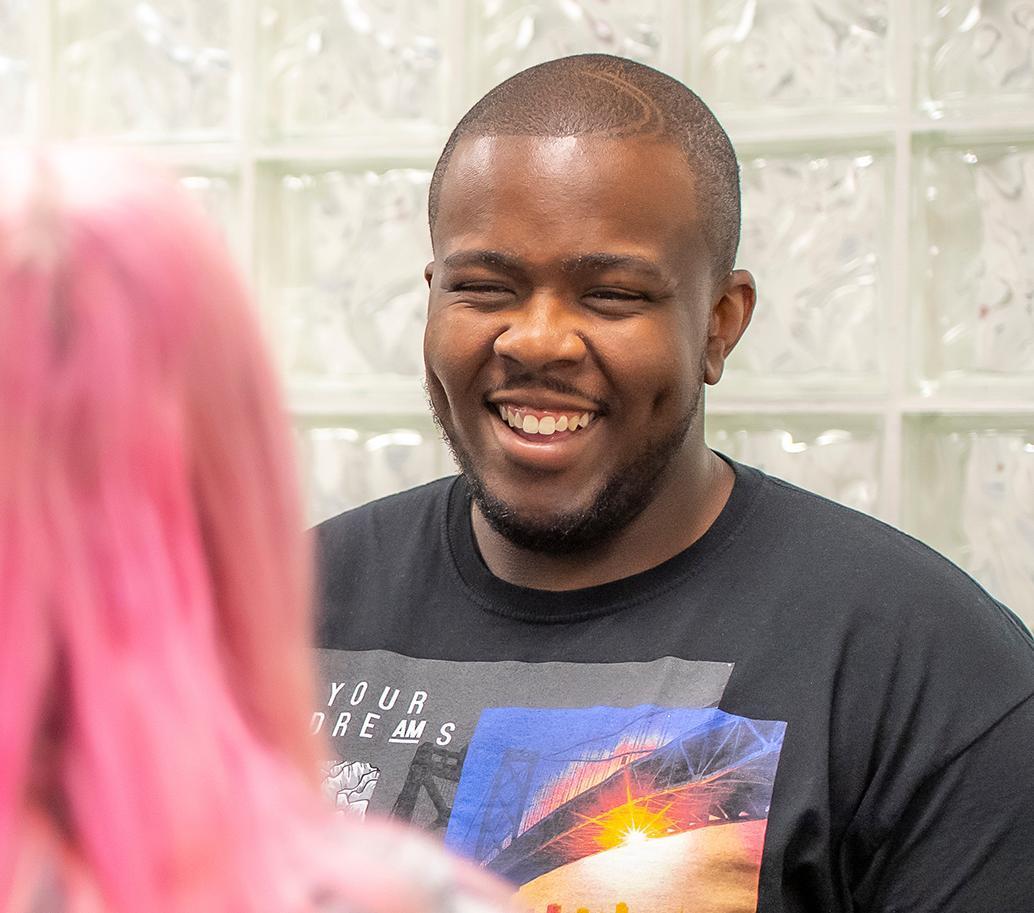 Male and Female student talking and smiling