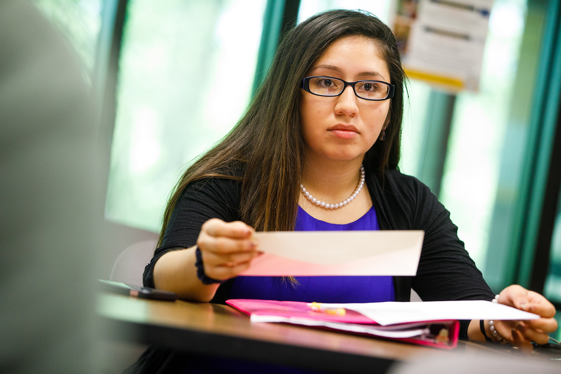 Female student in class with paper