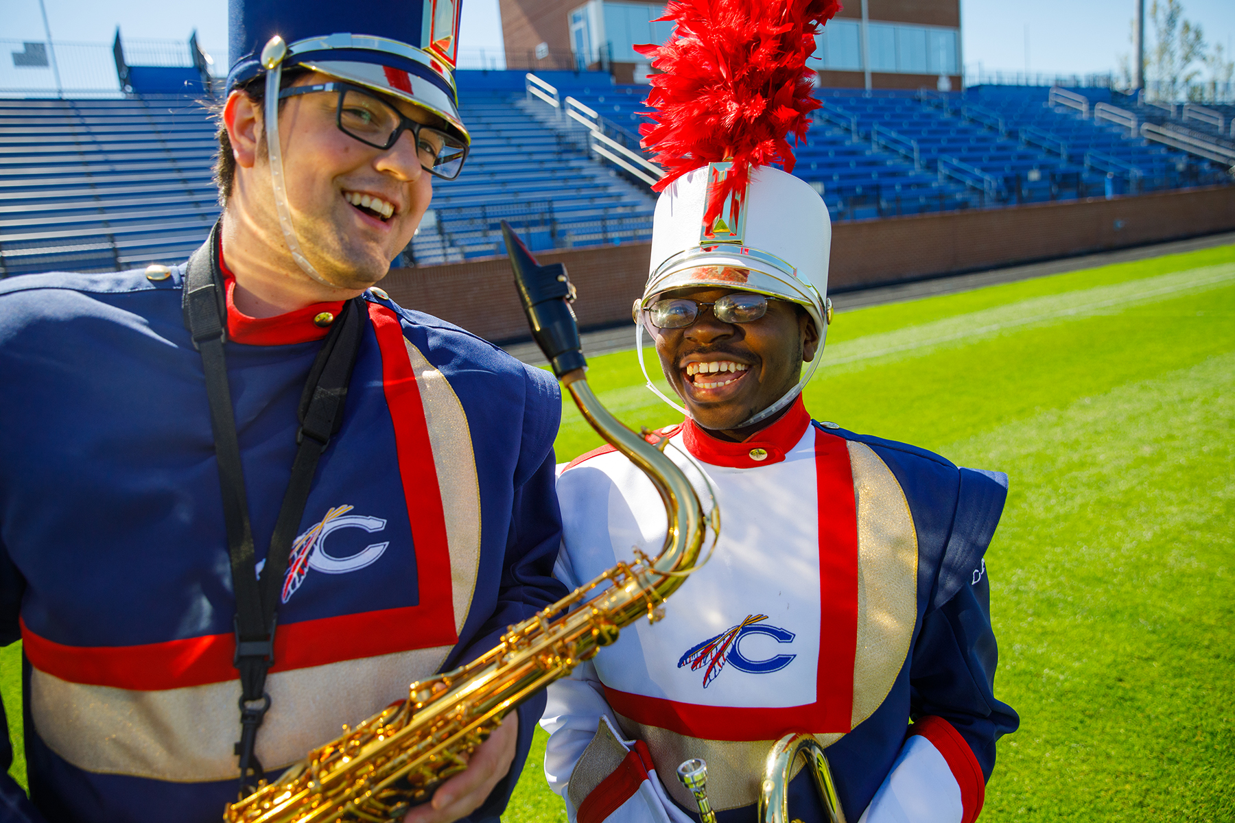 Marching Band Students with instruments on field