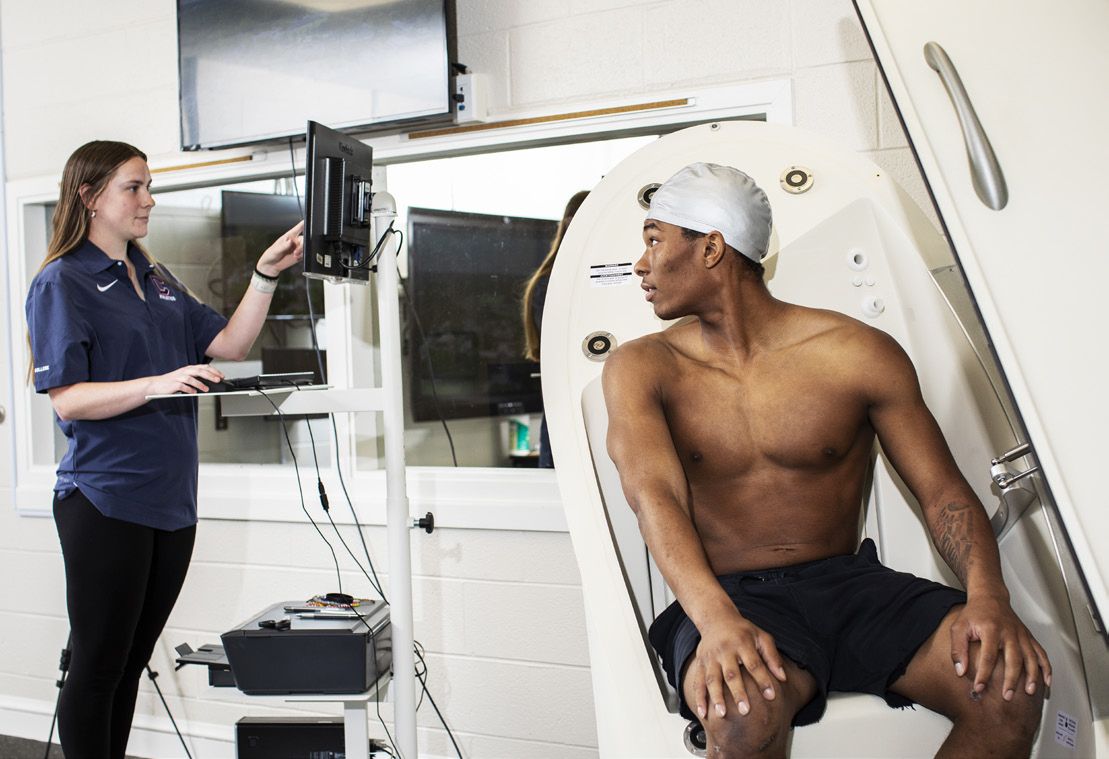 Student in Bod Pod machine
