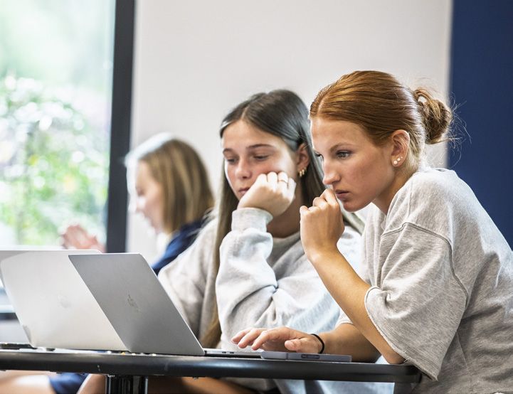 Students on laptops in class